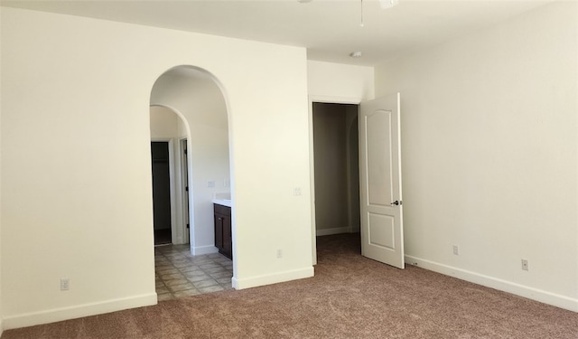 10372 Christo Way, Elk Grove, CA 95757 - unfurnished room featuring light colored carpet, arched walkways, baseboards, and ceiling fan