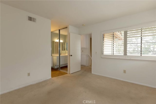 2150 Cheyenne Way Unit 165, Fullerton, CA 92833 - unfurnished bedroom featuring carpet flooring, baseboards, and ensuite bath