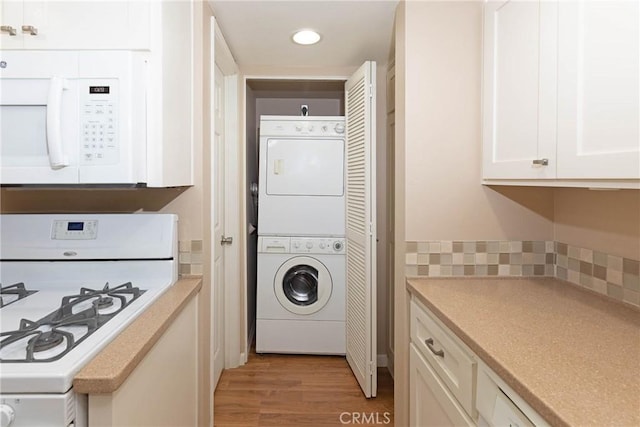 2150 Cheyenne Way Unit 165, Fullerton, CA 92833 - washroom with stacked washer / drying machine, light wood-style floors, and recessed lighting