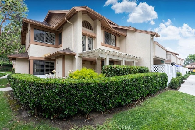 2150 Cheyenne Way Unit 165, Fullerton, CA 92833 - view of front of property with stucco siding and a pergola