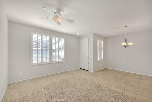 1080 Athens Way, Upland, CA 91786 - spare room featuring plenty of natural light, a ceiling fan, light tile patterned floors, and a chandelier