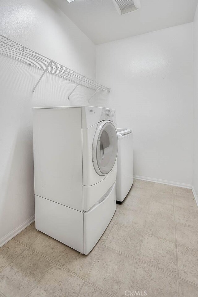 1080 Athens Way, Upland, CA 91786 - laundry area with independent washer and dryer and baseboards