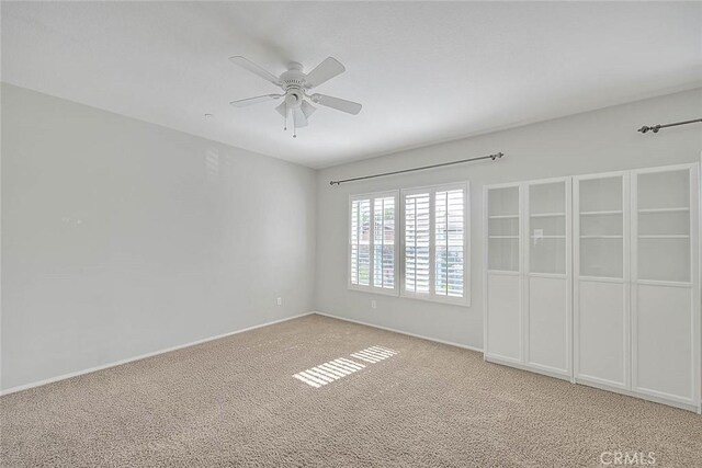 1080 Athens Way, Upland, CA 91786 - unfurnished bedroom featuring light carpet, baseboards, and ceiling fan