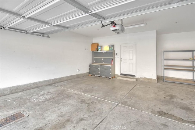 1080 Athens Way, Upland, CA 91786 - garage with a garage door opener and baseboards