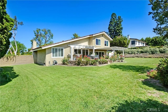 8640 Lindante Dr, Whittier, CA 90603 - back of house with a pergola, stucco siding, and a chimney