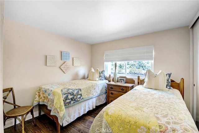 8640 Lindante Dr, Whittier, CA 90603 - bedroom featuring dark wood-style flooring and a closet