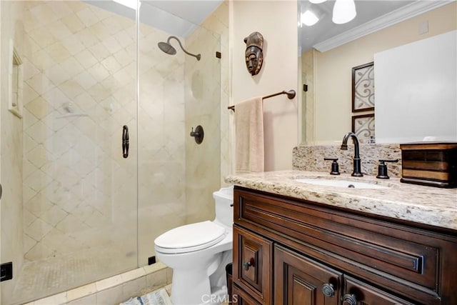 8640 Lindante Dr, Whittier, CA 90603 - bathroom featuring vanity, crown molding, a stall shower, and toilet