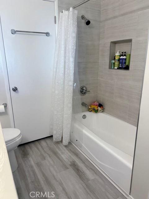 11529 De Celis Pl, Granada Hills, CA 91344 - full bathroom featuring shower / tub combo with curtain and wood finished floors