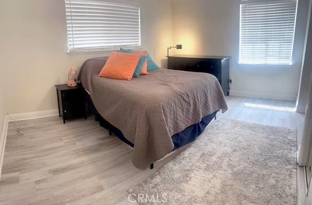 11529 De Celis Pl, Granada Hills, CA 91344 - bedroom with light wood-style floors and baseboards