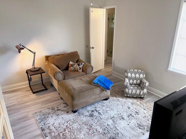 11529 De Celis Pl, Granada Hills, CA 91344 - living area with baseboards and wood finished floors