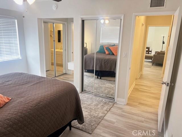 11529 De Celis Pl, Granada Hills, CA 91344 - bedroom featuring light wood finished floors, a closet, baseboards, and ensuite bath