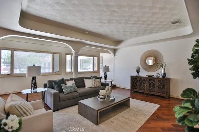 3624 Hollins Ave, Claremont, CA 91711 - living area with healthy amount of natural light, baseboards, wood finished floors, and decorative columns