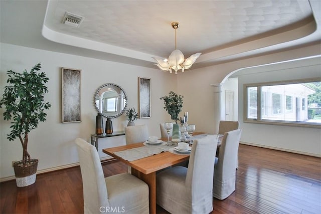 3624 Hollins Ave, Claremont, CA 91711 - dining area with a raised ceiling, arched walkways, a chandelier, and hardwood / wood-style floors
