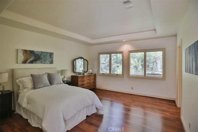 3624 Hollins Ave, Claremont, CA 91711 - bedroom featuring a tray ceiling, wood finished floors, and baseboards