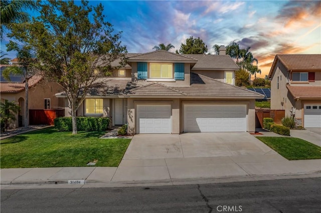 31484 Britton Cir, Temecula, CA 92591 - traditional home featuring stucco siding, a tiled roof, concrete driveway, a chimney, and a garage