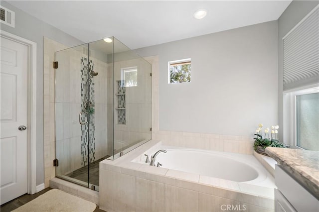 31484 Britton Cir, Temecula, CA 92591 - full bath featuring a garden tub, a stall shower, vanity, and recessed lighting