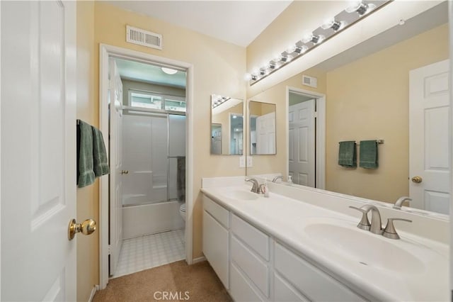31484 Britton Cir, Temecula, CA 92591 - full bathroom featuring double vanity, toilet, combined bath / shower with glass door, baseboards, and tile patterned floors