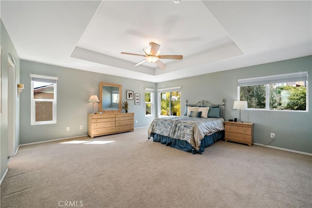 31484 Britton Cir, Temecula, CA 92591 - carpeted bedroom with a raised ceiling, baseboards, and a ceiling fan