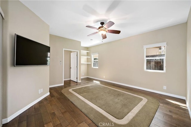 31484 Britton Cir, Temecula, CA 92591 - unfurnished living room with a ceiling fan, baseboards, and dark wood-style flooring