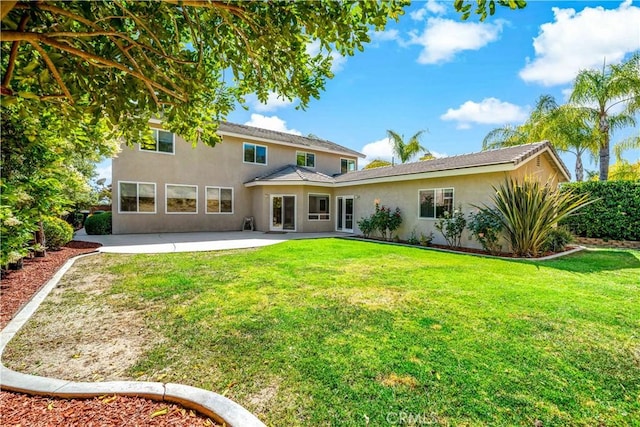 31484 Britton Cir, Temecula, CA 92591 - rear view of house featuring stucco siding, a patio area, and a yard