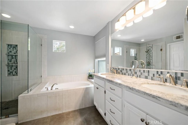 31484 Britton Cir, Temecula, CA 92591 - bathroom with a garden tub, a stall shower, tile patterned flooring, double vanity, and recessed lighting