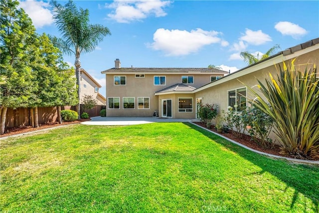 31484 Britton Cir, Temecula, CA 92591 - back of property with stucco siding, a patio, and a chimney