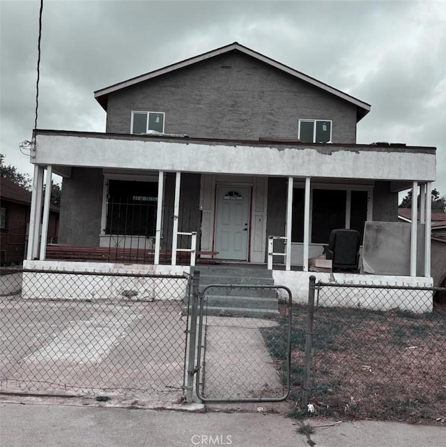 1825 E 109th Pl, Los Angeles, CA 90059 - view of front of house featuring covered porch, a gate, and a fenced front yard
