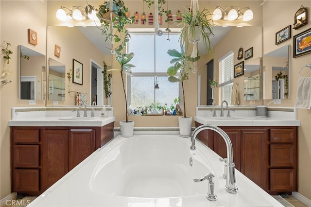 3245 Moss Landing Blvd, Oxnard, CA 93036 - bathroom featuring a bath and two vanities