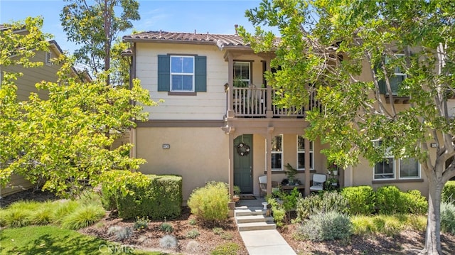 3245 Moss Landing Blvd, Oxnard, CA 93036 - view of front of property with a balcony and stucco siding