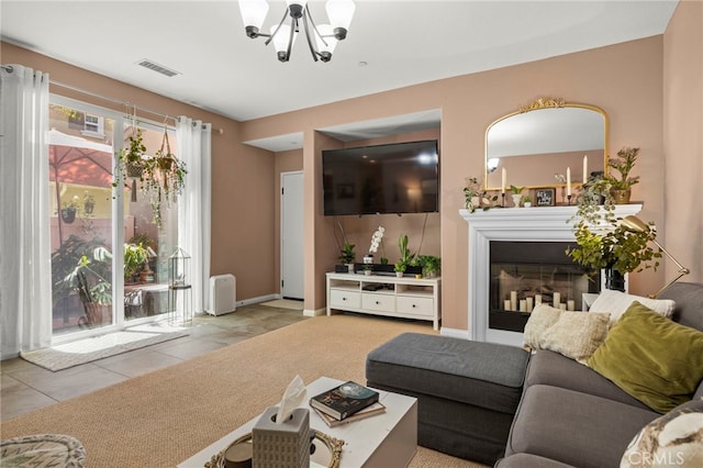 3245 Moss Landing Blvd, Oxnard, CA 93036 - tiled living room featuring a chandelier, a glass covered fireplace, and baseboards