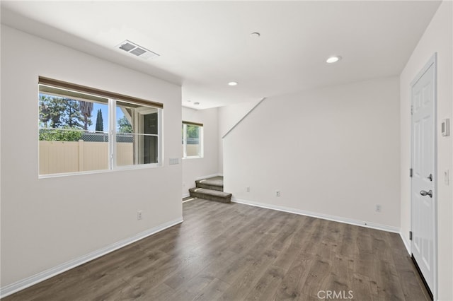 14856 Maple Ter, Panorama City, CA 91402 - spare room featuring stairs, dark wood finished floors, baseboards, and recessed lighting
