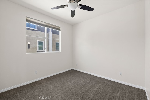 14856 Maple Ter, Panorama City, CA 91402 - empty room featuring a ceiling fan, dark carpet, and baseboards