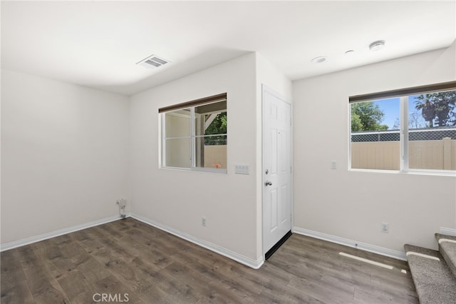 14856 Maple Ter, Panorama City, CA 91402 - foyer featuring baseboards, wood finished floors, and stairway