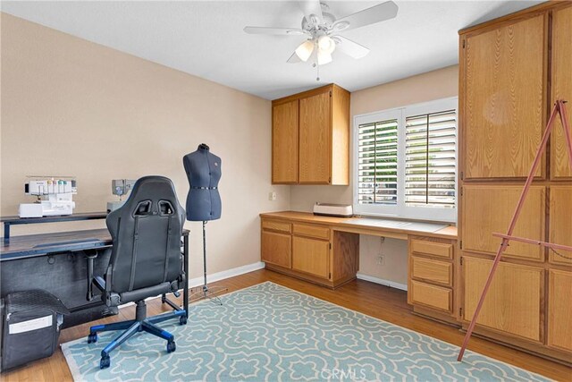 13950 High Falls Trl, Apple Valley, CA 92307 - office area featuring ceiling fan, wood finished floors, and baseboards