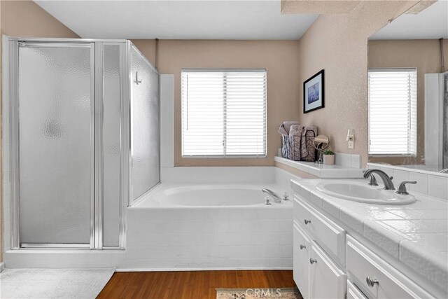 13950 High Falls Trl, Apple Valley, CA 92307 - full bath featuring a stall shower, healthy amount of natural light, vanity, and a garden tub