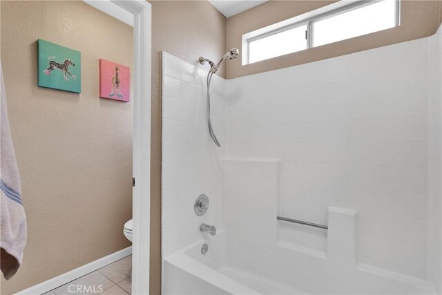 13950 High Falls Trl, Apple Valley, CA 92307 - bathroom with toilet, baseboards, shower / tub combination, tile patterned flooring, and a textured wall
