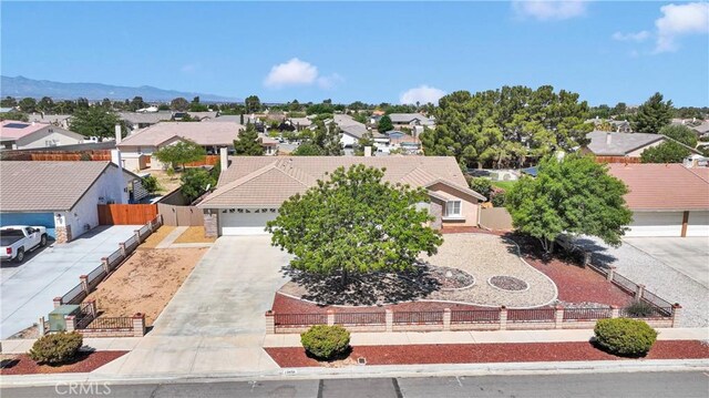13950 High Falls Trl, Apple Valley, CA 92307 - view of front of home with a residential view, concrete driveway, and an attached garage