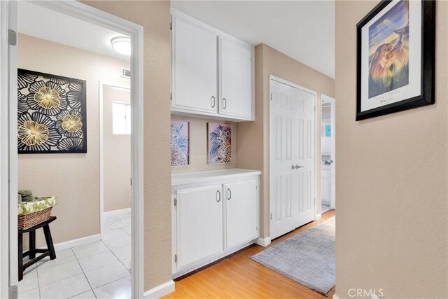 13950 High Falls Trl, Apple Valley, CA 92307 - hallway with baseboards and light tile patterned floors