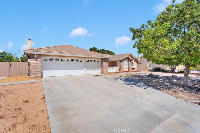 13950 High Falls Trl, Apple Valley, CA 92307 - ranch-style house with driveway, an attached garage, a chimney, brick siding, and a tiled roof