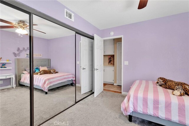 13950 High Falls Trl, Apple Valley, CA 92307 - bedroom with light carpet, a closet, baseboards, and ceiling fan