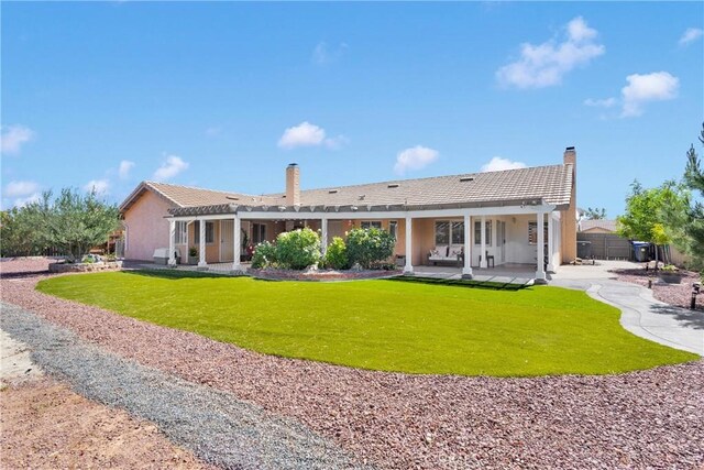 13950 High Falls Trl, Apple Valley, CA 92307 - rear view of house with a pergola, a patio area, stucco siding, and a chimney