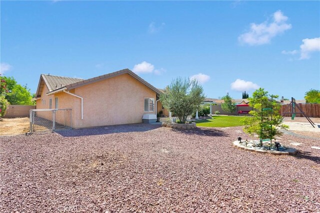 13950 High Falls Trl, Apple Valley, CA 92307 - view of yard with a gate