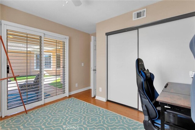 13950 High Falls Trl, Apple Valley, CA 92307 - home office featuring wood finished floors, ceiling fan, and baseboards