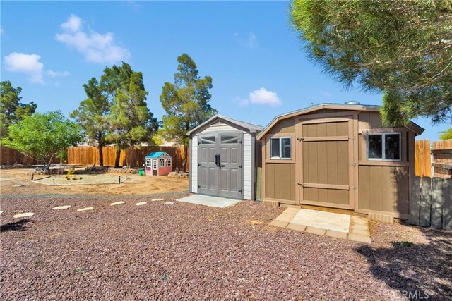 13950 High Falls Trl, Apple Valley, CA 92307 - view of shed with a fenced backyard
