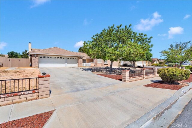 13950 High Falls Trl, Apple Valley, CA 92307 - ranch-style home with driveway, a garage, a chimney, brick siding, and a gate