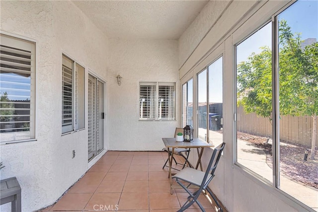 13950 High Falls Trl, Apple Valley, CA 92307 - sunroom / solarium featuring a textured wall, tile patterned floors, and a textured ceiling