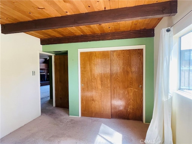 2521 Cedarwood Dr, Pine Mountain Club, CA 93222 - unfurnished bedroom featuring wood ceiling with exposed beams, carpet flooring, and a closet