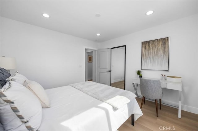 201 S Melrose St, Placentia, CA 92870 - bedroom featuring light wood-style floors, a closet, recessed lighting, baseboards, and an office area