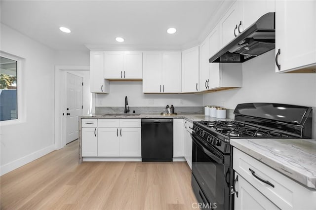 201 S Melrose St, Placentia, CA 92870 - kitchen featuring black appliances, a sink, under cabinet range hood, light wood-type flooring, and white cabinets