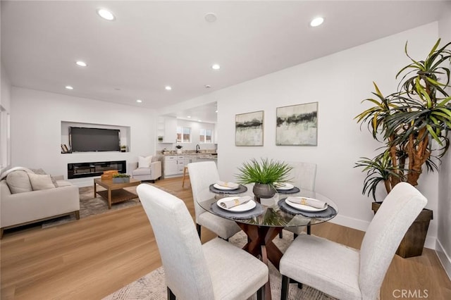 201 S Melrose St, Placentia, CA 92870 - dining area featuring recessed lighting, light wood finished floors, and baseboards